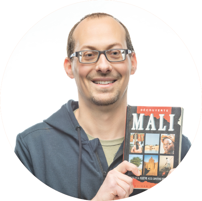 XAVIER TISSIER holding a book