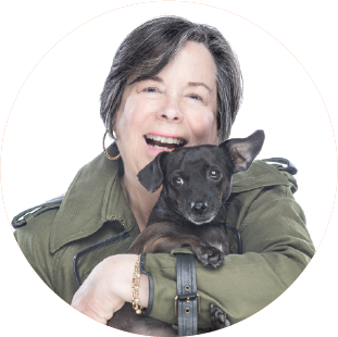 Laurie Winthrop holding a puppy.